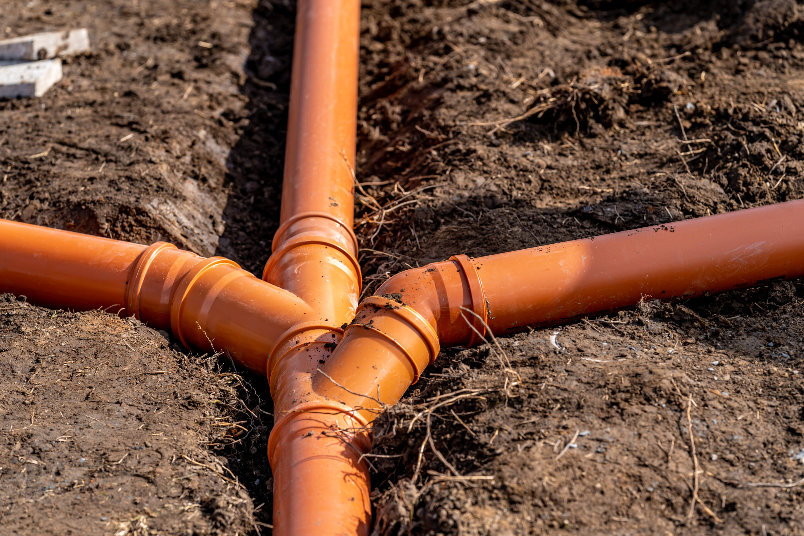 sewage system made of plastic PVC pipes in the ground.